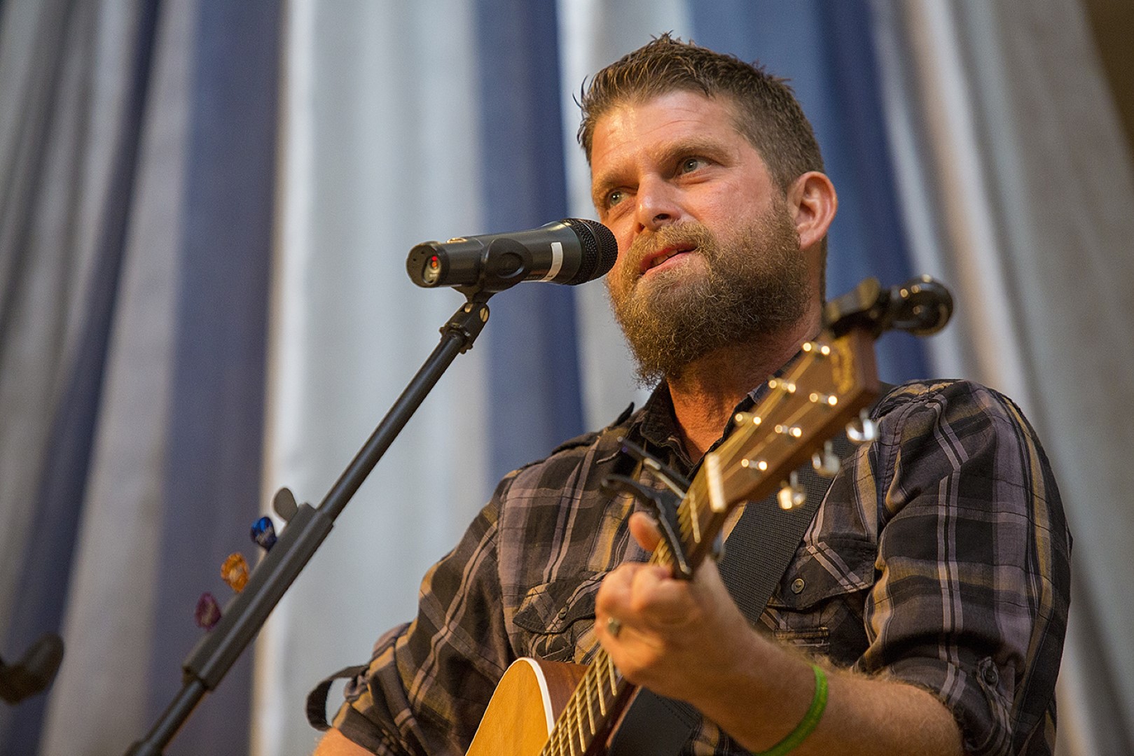 Joe Miller singing and playing guitar at TOLM's 2018 gala.